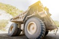 Driver walks up a large mining dump truck