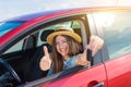 Driver woman smiling showing new car keys and car. Royalty Free Stock Photo