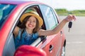 Driver woman smiling showing new car keys and car. Royalty Free Stock Photo