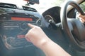 Driver& x27;s Hand Press Button on Car Radio Royalty Free Stock Photo