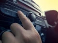 Driver& x27;s Hand Press Button on Car Radio Royalty Free Stock Photo