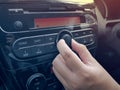 Driver& x27;s Hand Press Button on Car Radio Royalty Free Stock Photo