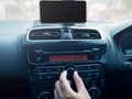 Driver& x27;s Hand Press Button on Car Radio Royalty Free Stock Photo