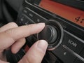 Driver& x27;s Hand Press Button on Car Radio Royalty Free Stock Photo