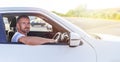 The driver is a young attractive man driving a car. Royalty Free Stock Photo
