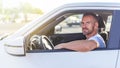 The driver is a young attractive man driving a car. Royalty Free Stock Photo