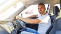 The driver is a young attractive man driving a car. Royalty Free Stock Photo