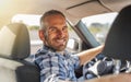 The driver is a young attractive man driving a car. Royalty Free Stock Photo