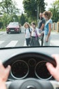 Family with children crossing a street on pedestrian area Royalty Free Stock Photo