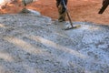 During the paving of a driveway at a new home on a construction site, we were poured wet concrete as hard as the paving Royalty Free Stock Photo