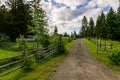 Driveway to the farm with welcome sign tree lined country road Royalty Free Stock Photo