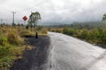 Driving across the caldera ridge road among view of extinct crater of the volcano Batur