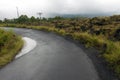 Driving across the caldera ridge road among view of extinct crater of the volcano Batur