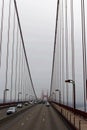 Driving across the Golden Gate Bridge on a very foggy day with the towers shrouded in fog, San Francisco