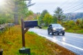 Driving along a mountain road in foliage season on a rainy day Royalty Free Stock Photo