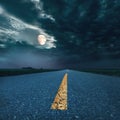 Driving on asphalt road at night towards the moon Royalty Free Stock Photo