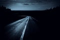 Driving on asphalt road at spooky night Royalty Free Stock Photo