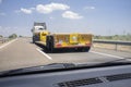 Driving behind empty oversize load truck Royalty Free Stock Photo