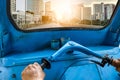 Driving blue tricycle tuk-tuk to sunlight urban city