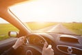 Driving car, hands of driver on steering wheel Royalty Free Stock Photo