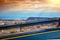 View from the car window to the desert landscape and the Dead Sea at sunset Royalty Free Stock Photo