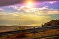 View from the car window to the desert landscape and the Dead Sea at sunset Royalty Free Stock Photo