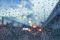 Driving car on metropolis road in trafic jam with raindrop over the wind shield Royalty Free Stock Photo