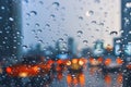 Driving car on metropolis road in trafic jam with raindrop over the wind shield Royalty Free Stock Photo