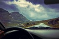 Driving a car on mountain road Royalty Free Stock Photo