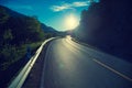 Driving a car on a mountain road at sunset Royalty Free Stock Photo