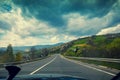 Driving a car on mountain road Royalty Free Stock Photo