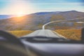 Driving a car on a mountain winding road Royalty Free Stock Photo