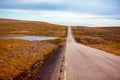 Driving a car on road in tundra. The way to Nordkapp Royalty Free Stock Photo