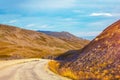 Driving a car on road in tundra. Nature of Norway Royalty Free Stock Photo