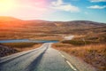 Driving a car on road in tundra. Nature of Norway Royalty Free Stock Photo