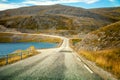 Driving a car on road in tundra. Nature of Norway Royalty Free Stock Photo
