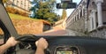 Driving a car on the slope to the Udine Castle, Italy