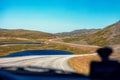 Driving a car in the tundra in summer Royalty Free Stock Photo