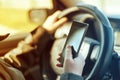 Driving car and using mobile phone to send text message Royalty Free Stock Photo