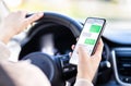 Driving car and using phone. Distracted driver texting with mobile cellphone. Irresponsible woman checking sms message. Royalty Free Stock Photo