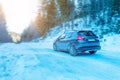 Driving a car in winter through a mountain road Royalty Free Stock Photo