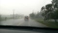 Driving down country road on a rainy day. Royalty Free Stock Photo