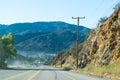 Driving down foggy highway in Malibu Creek State Park Royalty Free Stock Photo