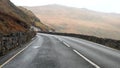 Driving down winding mountain road in Wales