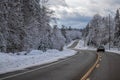 Driving Down a Winding Winter Country Road Royalty Free Stock Photo