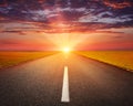 Driving on an empty asphalt road at sunset Royalty Free Stock Photo