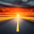 Driving on an empty asphalt road at sunset Royalty Free Stock Photo