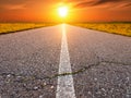 Driving on an empty asphalt road towards the sun Royalty Free Stock Photo