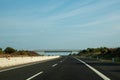 Driving on empty highway asphalt road and beautiful sky in summer day landscape Royalty Free Stock Photo