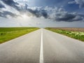 Driving on an empty road at idyllic sunny day Royalty Free Stock Photo